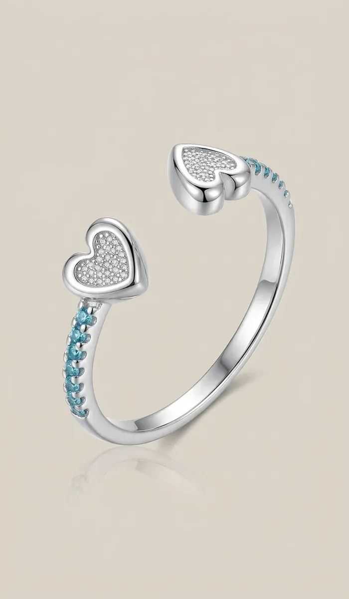 Сребърен пръстен с двойно сърце и син циркон