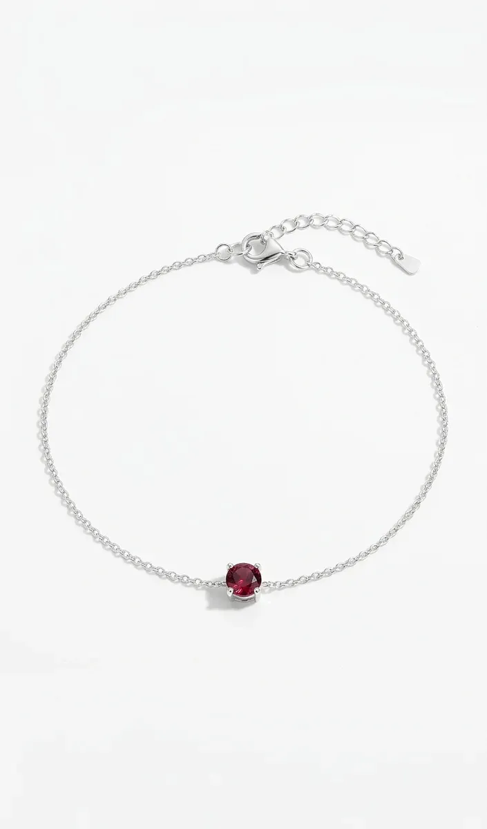 Златиста гривна с червен циркон